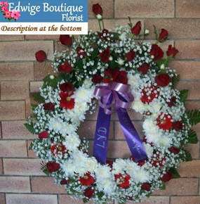 Round Funeral Wreath with red roses and gerberas and white gypsophila and crysenthem